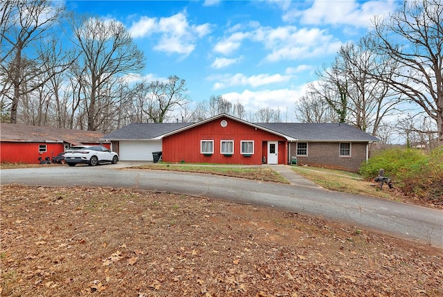 single story home featuring a garage