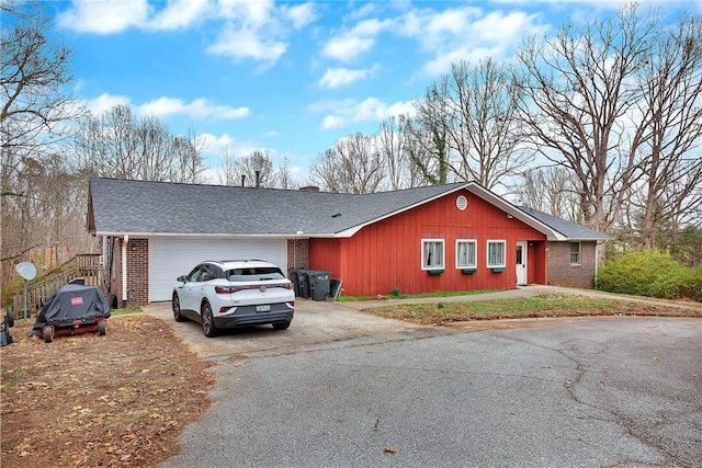 ranch-style house featuring a garage