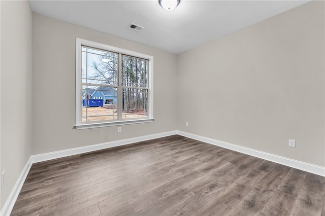 empty room featuring dark hardwood / wood-style floors