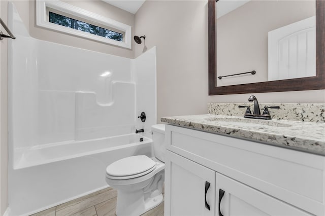 full bathroom with vanity, wood-type flooring, toilet, and shower / bathing tub combination