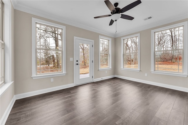 unfurnished sunroom featuring ceiling fan