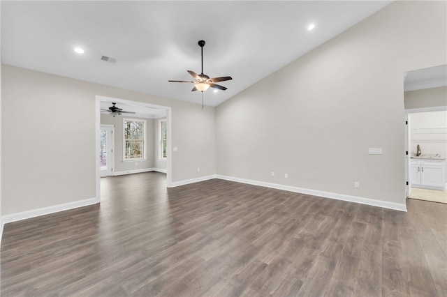 unfurnished living room featuring wood-type flooring, lofted ceiling, and ceiling fan