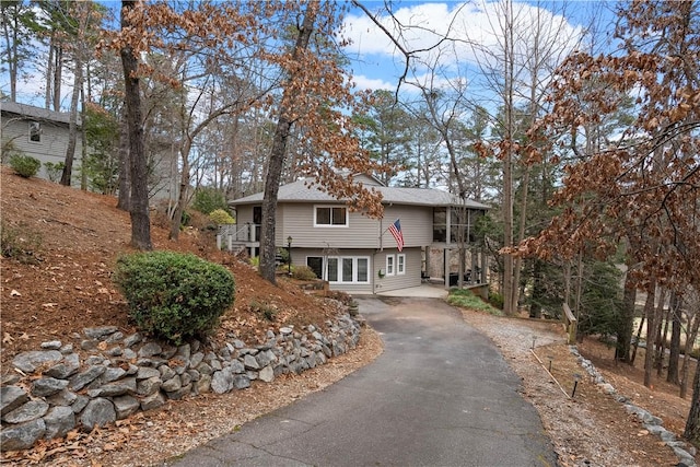 view of front of home featuring a sunroom