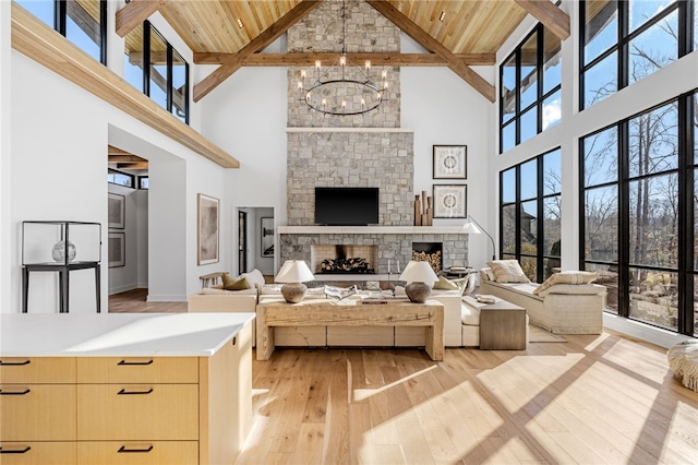 living room with plenty of natural light, a fireplace, and light hardwood / wood-style floors