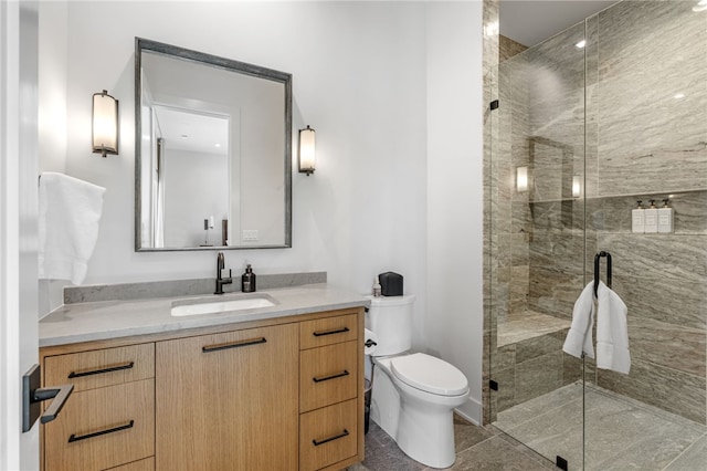 bathroom with vanity, toilet, and walk in shower