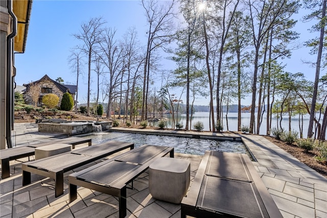 view of patio / terrace featuring a water view and pool water feature