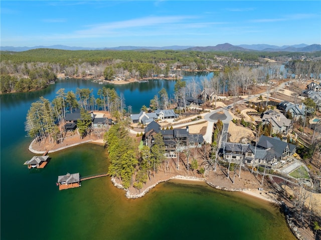 aerial view featuring a water and mountain view