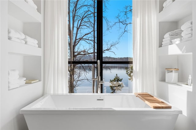 bathroom with a tub