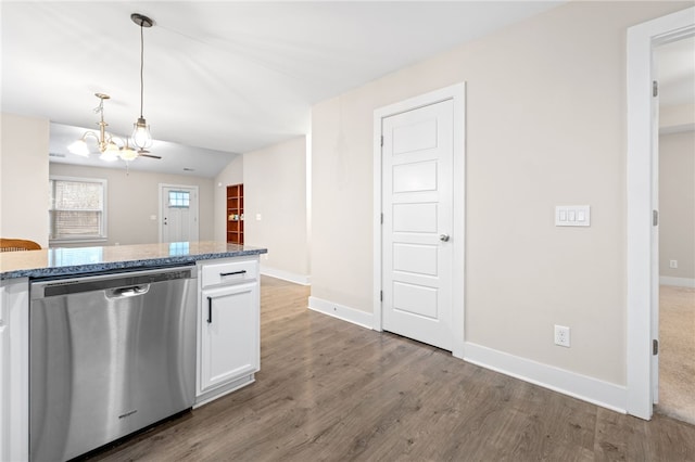 kitchen featuring white cabinetry, light hardwood / wood-style floors, stone countertops, decorative light fixtures, and stainless steel dishwasher