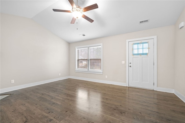 foyer entrance with ceiling fan, dark hardwood / wood-style flooring, and vaulted ceiling