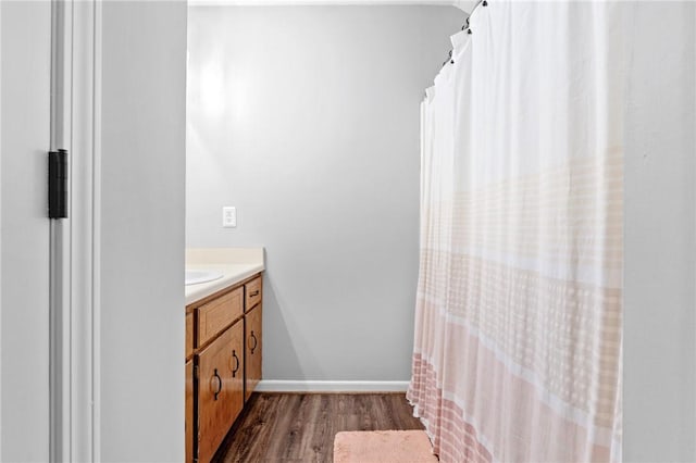 bathroom with vanity and hardwood / wood-style flooring