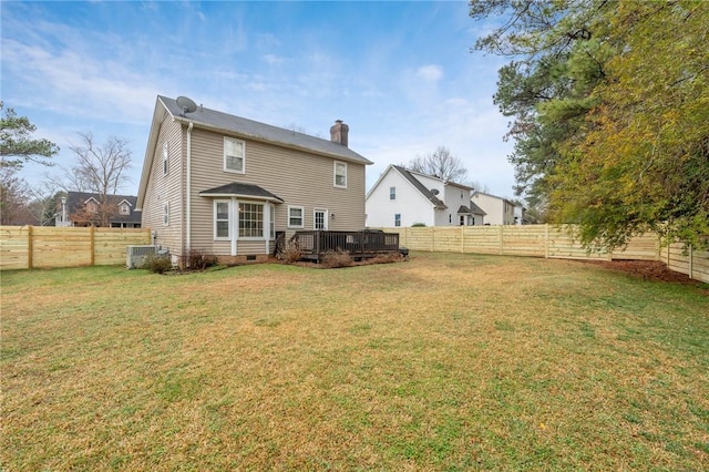 rear view of property featuring a wooden deck, central AC unit, and a lawn