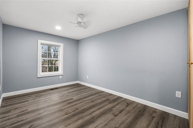 empty room with dark hardwood / wood-style floors