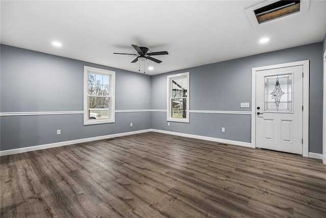 interior space with dark wood-type flooring and ceiling fan