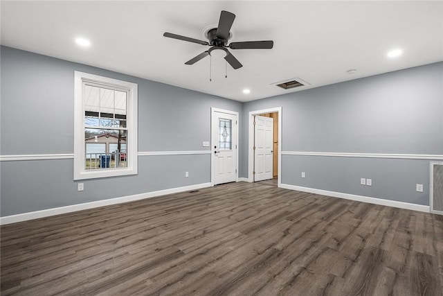 unfurnished room featuring ceiling fan and dark hardwood / wood-style flooring