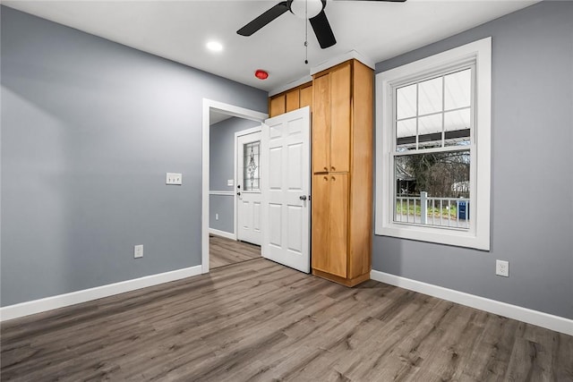 unfurnished bedroom with hardwood / wood-style flooring and ceiling fan