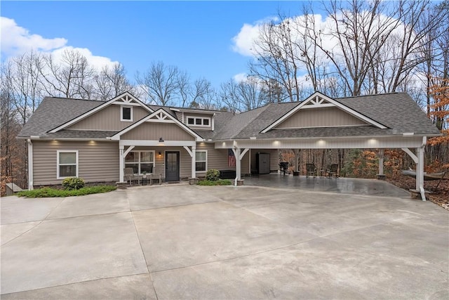 craftsman-style home with a carport