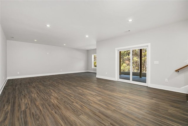 unfurnished room with dark hardwood / wood-style floors