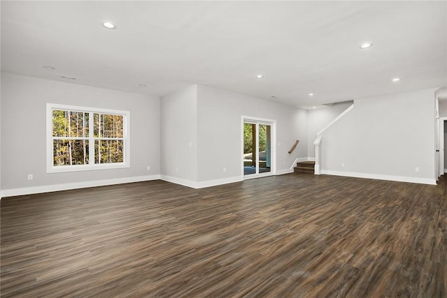 unfurnished living room with dark hardwood / wood-style floors