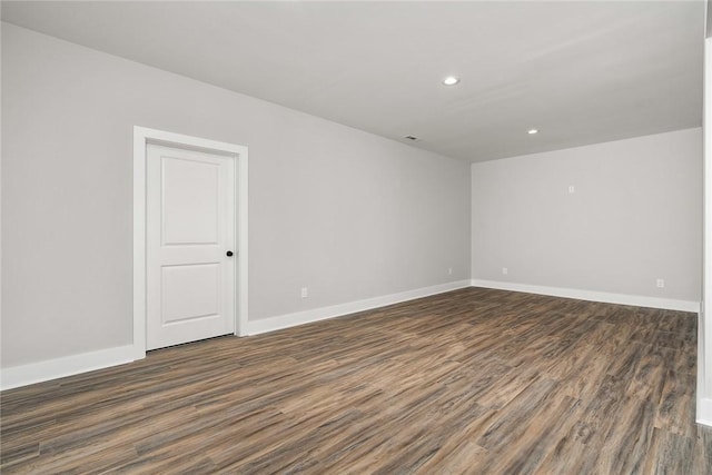 empty room featuring dark hardwood / wood-style floors