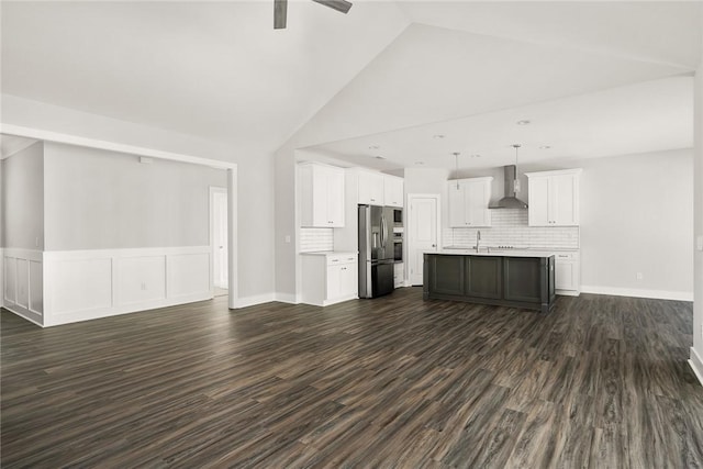 unfurnished living room with sink, dark wood-type flooring, high vaulted ceiling, and ceiling fan