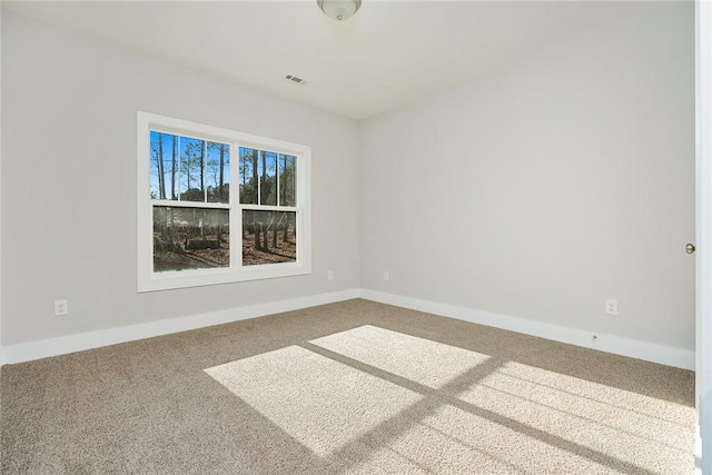 spare room featuring carpet flooring