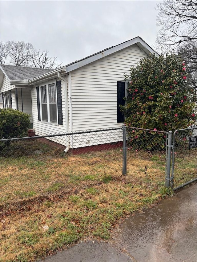 view of property exterior with a yard