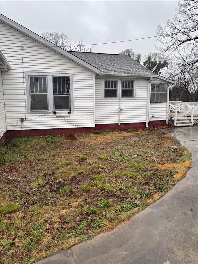 view of property exterior featuring a sunroom