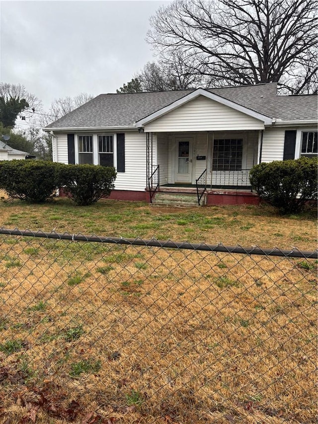 ranch-style house with covered porch and a front yard