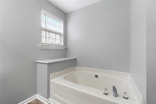 bathroom featuring a washtub