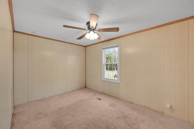 3301 Jones Chapel Rd, Honea Path, SC 29654 - carpeted spare room featuring ceiling fan, ornamental molding, and a textured ceiling
