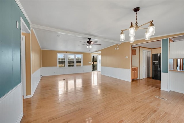 3301 Jones Chapel Rd, Honea Path, SC 29654 - empty room featuring crown molding, hardwood / wood-style floors, and ceiling fan with notable chandelier