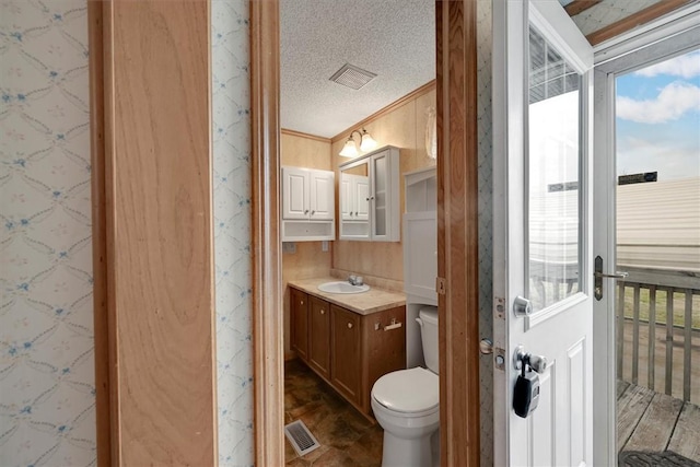 3301 Jones Chapel Rd, Honea Path, SC 29654 - bathroom with crown molding, vanity, toilet, and a textured ceiling
