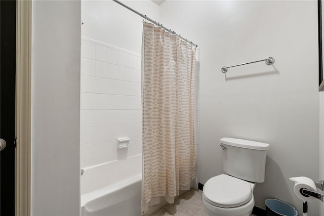 bathroom with tile patterned floors, toilet, and shower / bath combo