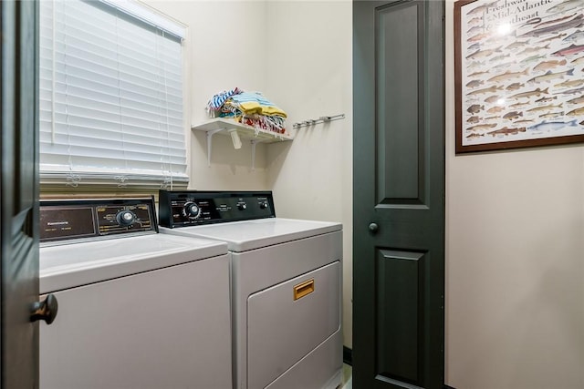 laundry room with washing machine and dryer