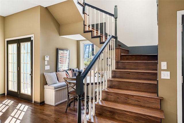 stairs featuring hardwood / wood-style floors