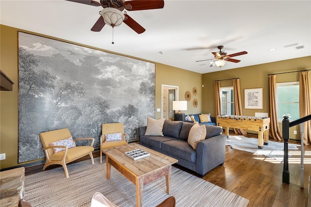 living room featuring hardwood / wood-style flooring and ceiling fan