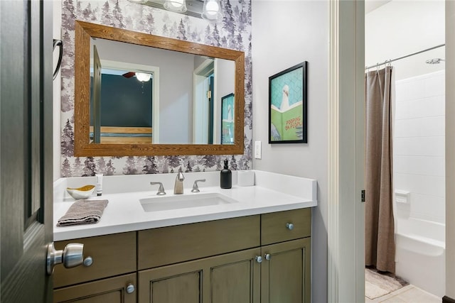 bathroom featuring vanity and shower / bathtub combination with curtain