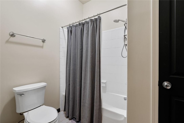 bathroom featuring toilet and shower / bath combo with shower curtain