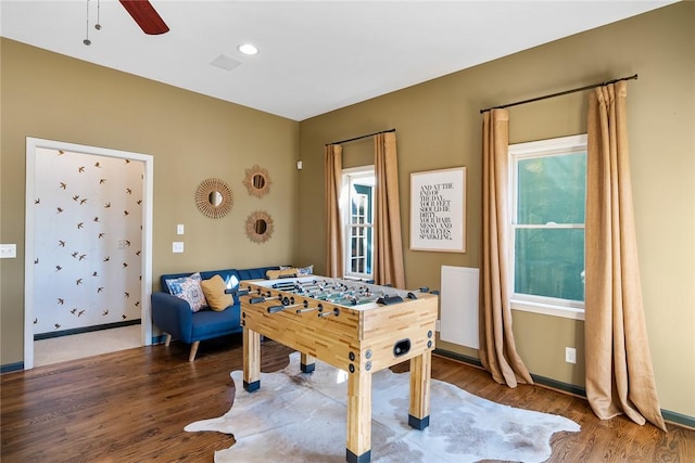 playroom with hardwood / wood-style flooring and ceiling fan