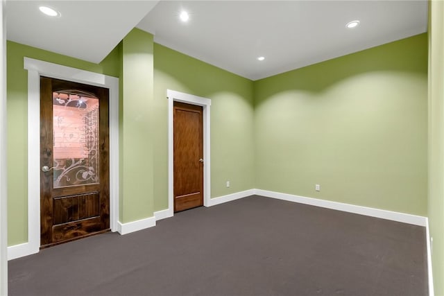 empty room with dark carpet