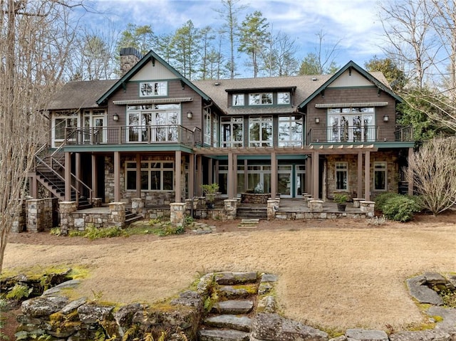 rear view of house featuring a balcony