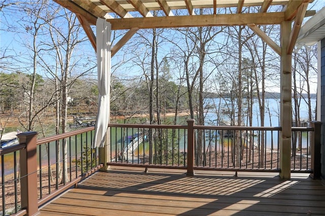 wooden terrace featuring a water view