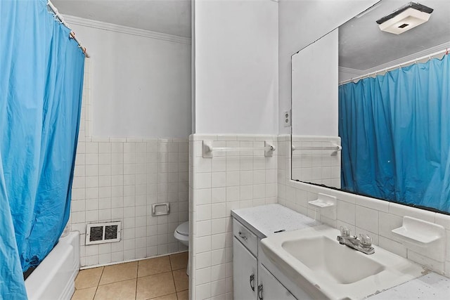 full bathroom with shower / bath combination with curtain, tile patterned flooring, vanity, toilet, and crown molding