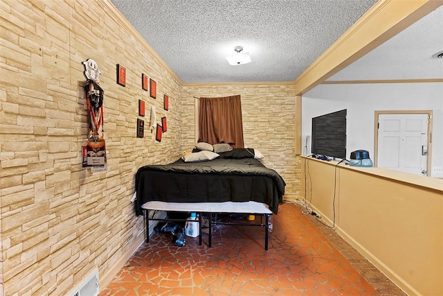 bedroom with crown molding and a textured ceiling