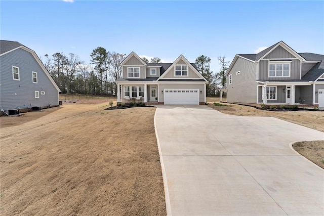 craftsman-style house with driveway, covered porch, a garage, central air condition unit, and board and batten siding