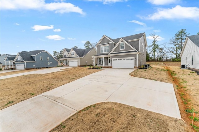 view of front of property with cooling unit, a residential view, board and batten siding, concrete driveway, and a garage