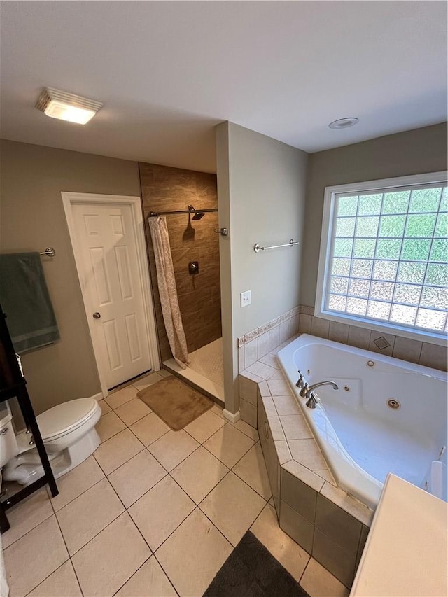 bathroom with tile patterned floors, independent shower and bath, and toilet