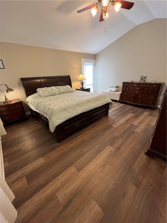 bedroom featuring ceiling fan, dark hardwood / wood-style floors, and vaulted ceiling