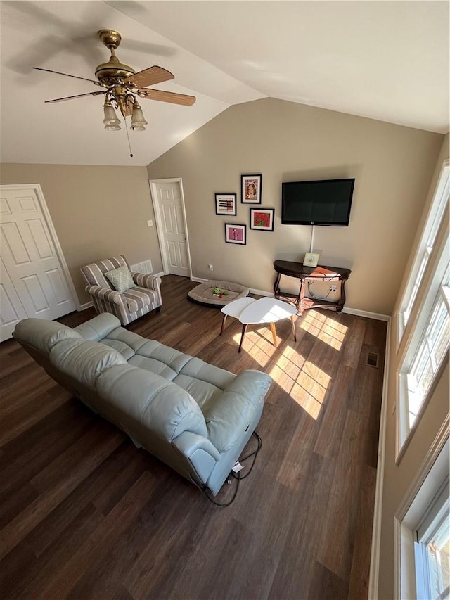 living room featuring vaulted ceiling, ceiling fan, and dark hardwood / wood-style flooring